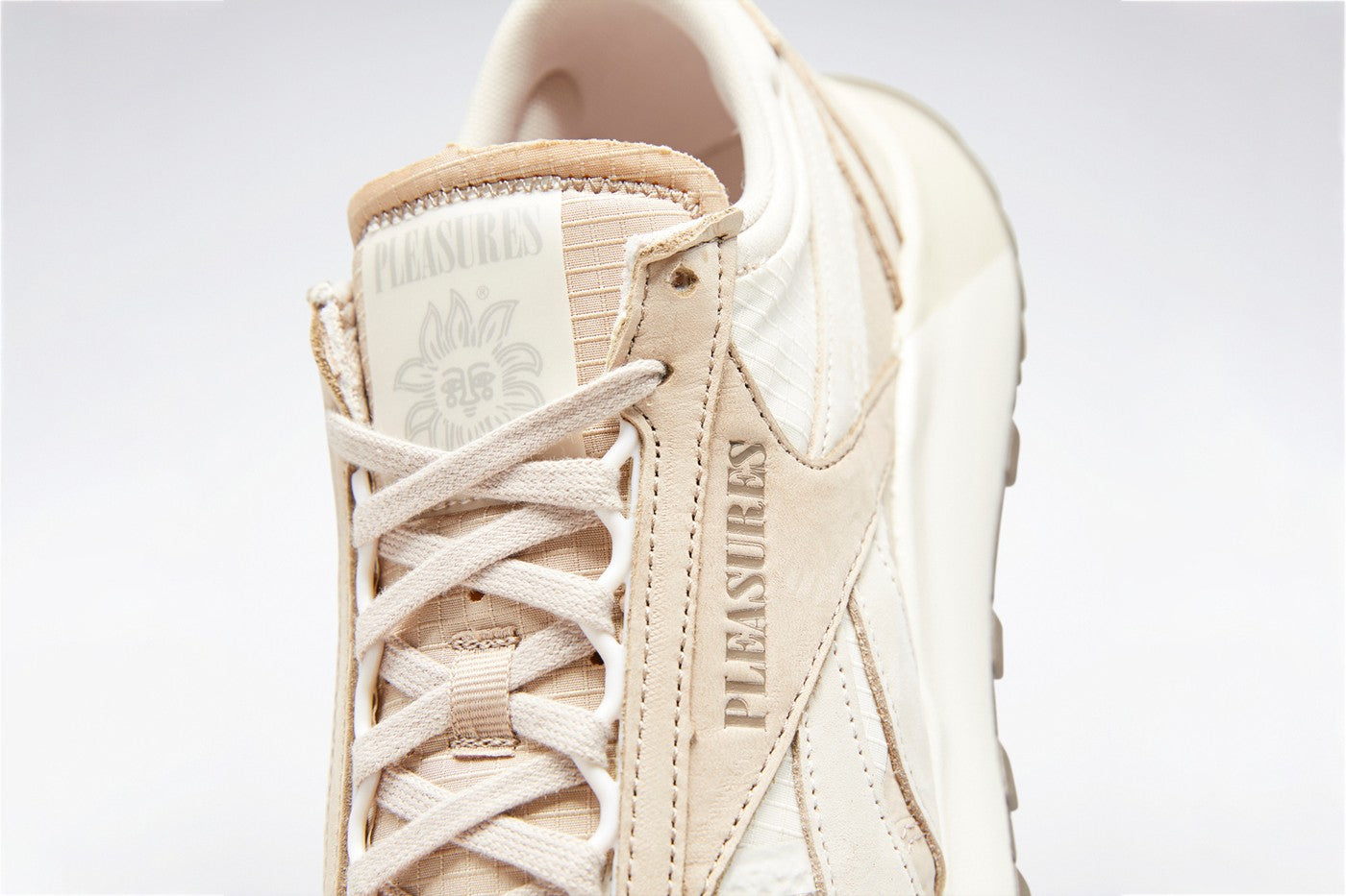 PLEASURES x REEBOK CL LEGACY